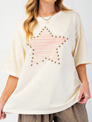 Cream t-shirt with pink striped star graphic and stud details.