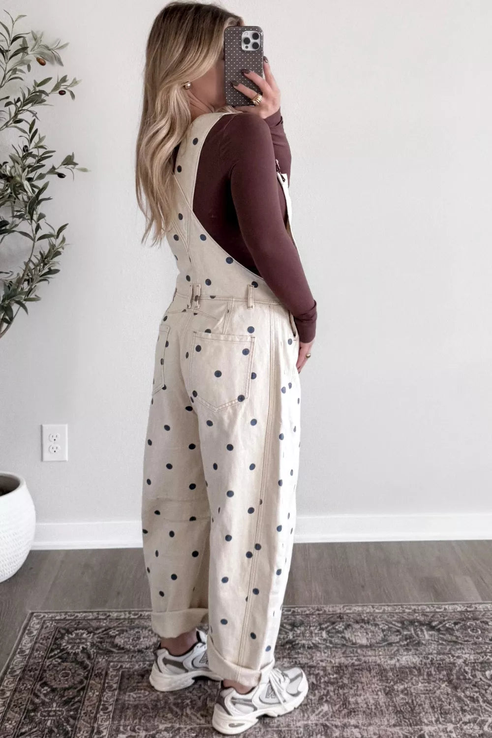 Denim overalls with polka dots, buttoned front, and cuffed legs.