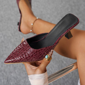 Chic burgundy croc-embossed pointed toe flare heel sandals with a low heel.