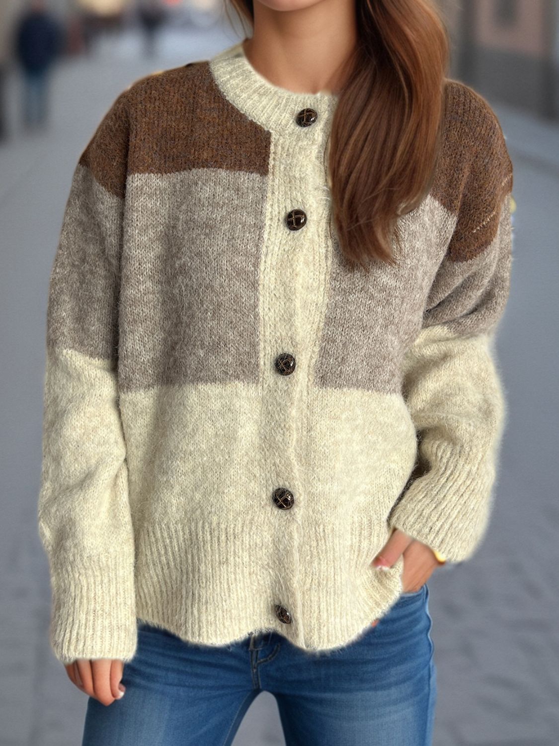 Colorblock crewneck button-down acrylic cardigan with brown, gray, and beige panels.
