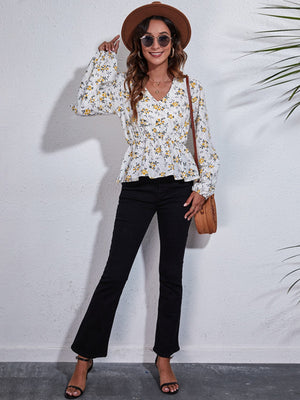White floral peplum blouse with gathered waist and balloon sleeves