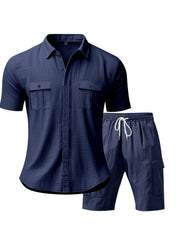 Navy blue relaxed-fit button-up shirt and drawstring shorts set with dual chest pockets.