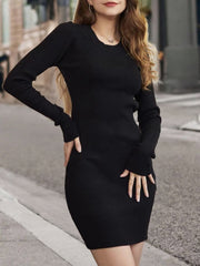 Black ribbed knit mini dress with long sleeves and an open back detail.
