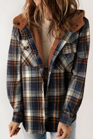 Sherpa-lined plaid overshirt jacket in blue and tan with button front and chest pockets.