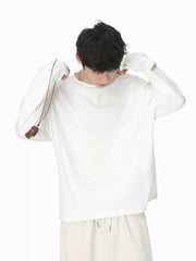 Relaxed fit white cotton long sleeve t-shirt with crew neck.