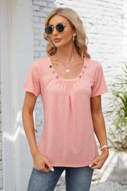 Watermelon pink gathered yoke top with button trim and short sleeves.