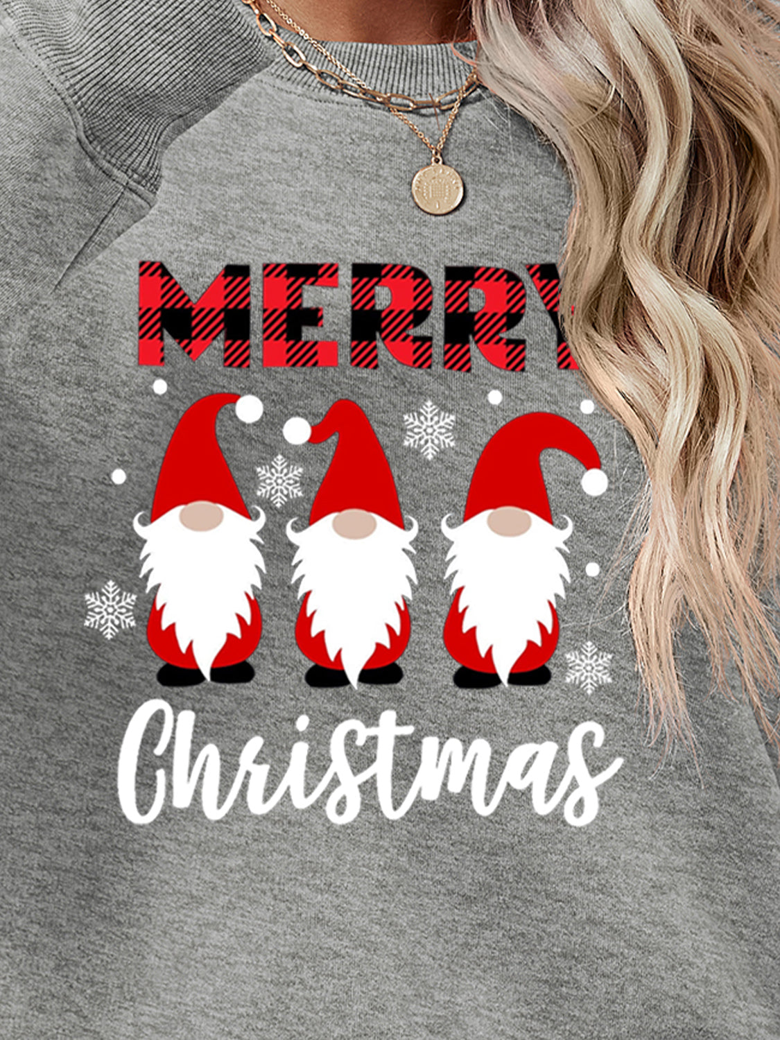 Grey Christmas gnome graphic sweatshirt with Merry Christmas text and snowflakes.
