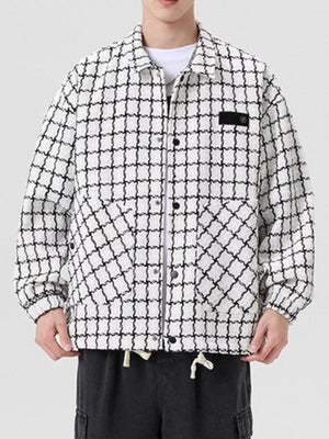 Oversized white plaid button-up jacket with black grid pattern and chest pocket detail.