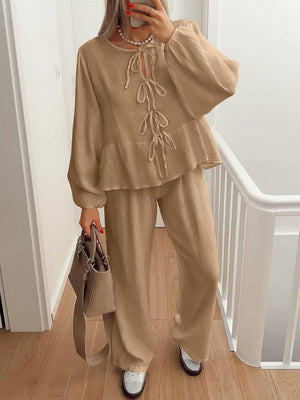 Camel textured peplum co-ord set with tie-neck and balloon sleeves.