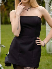 Black strapless tube top dress with lace hem detail.