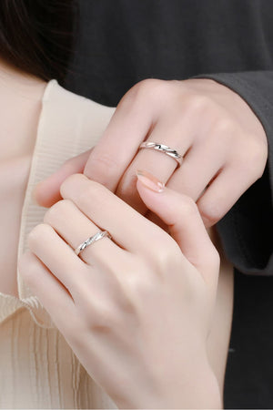 Twisted embrace silver ring set, 925 sterling silver, one with small stones.