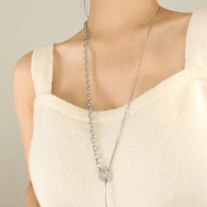 Silver asymmetrical chain and bar necklace with a snake chain detail.
