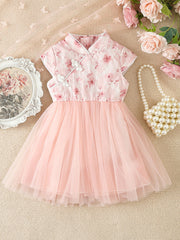 Pink floral cap sleeve baby dress with tulle skirt and mandarin collar.