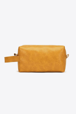 Textured faux leather travel case in gold with a carry handle.