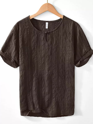 Textured short sleeve men's blouse in chocolate cotton with a button-neck detail.