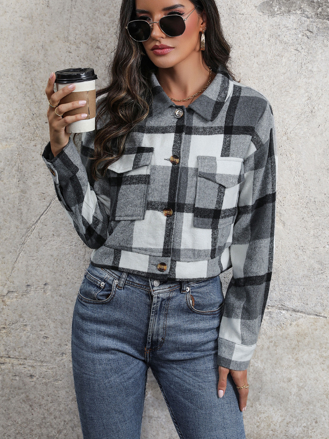 Checked plaid shacket in dark gray with patch pockets and button closure.