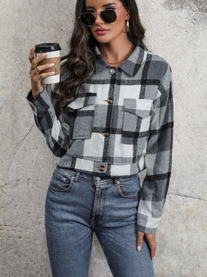 Checked plaid shacket in dark gray with patch pockets and button closure.
