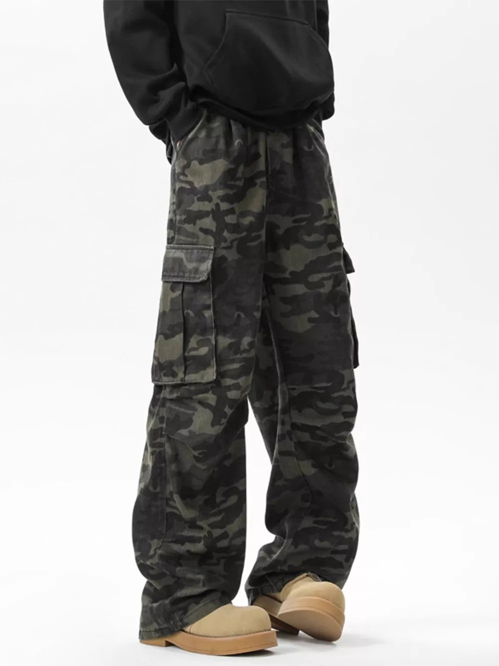 Relaxed fit dark camo cargo pants with multiple pockets.