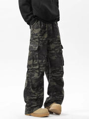 Relaxed fit dark camo cargo pants with multiple pockets.