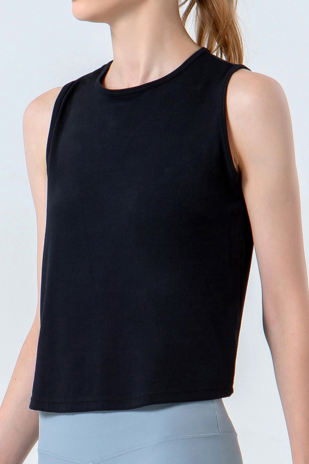 Black performance tank top with a round neckline and sleeveless design.