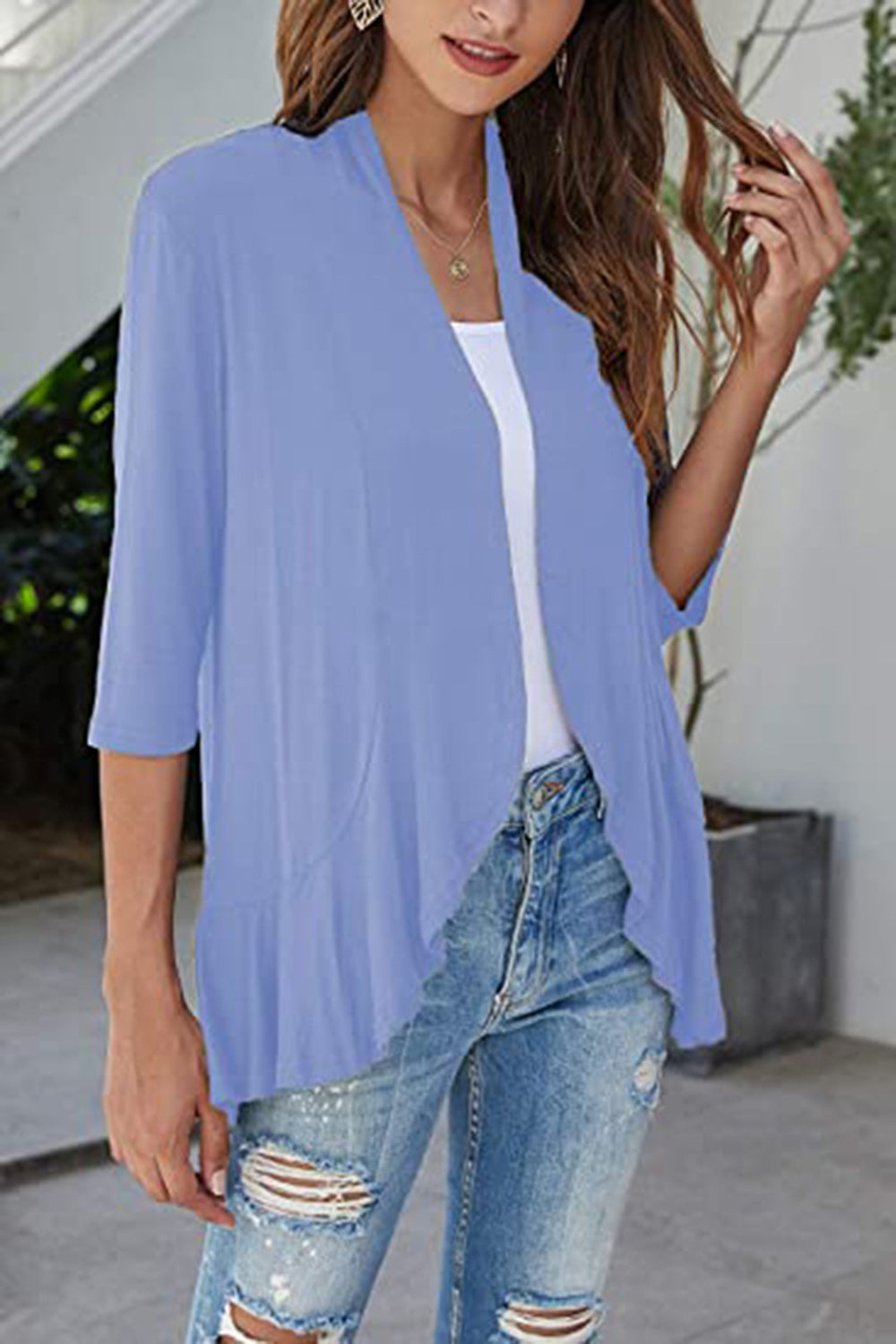 Light blue cardigan with 3/4 sleeves and asymmetrical ruffle hem