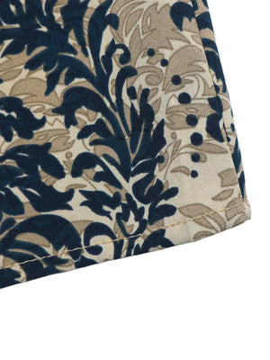 Ornate cap sleeve blouse in navy and tan floral print with notch neckline detail.