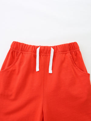 Red cotton toddler shorts with elastic waistband and white drawstring.