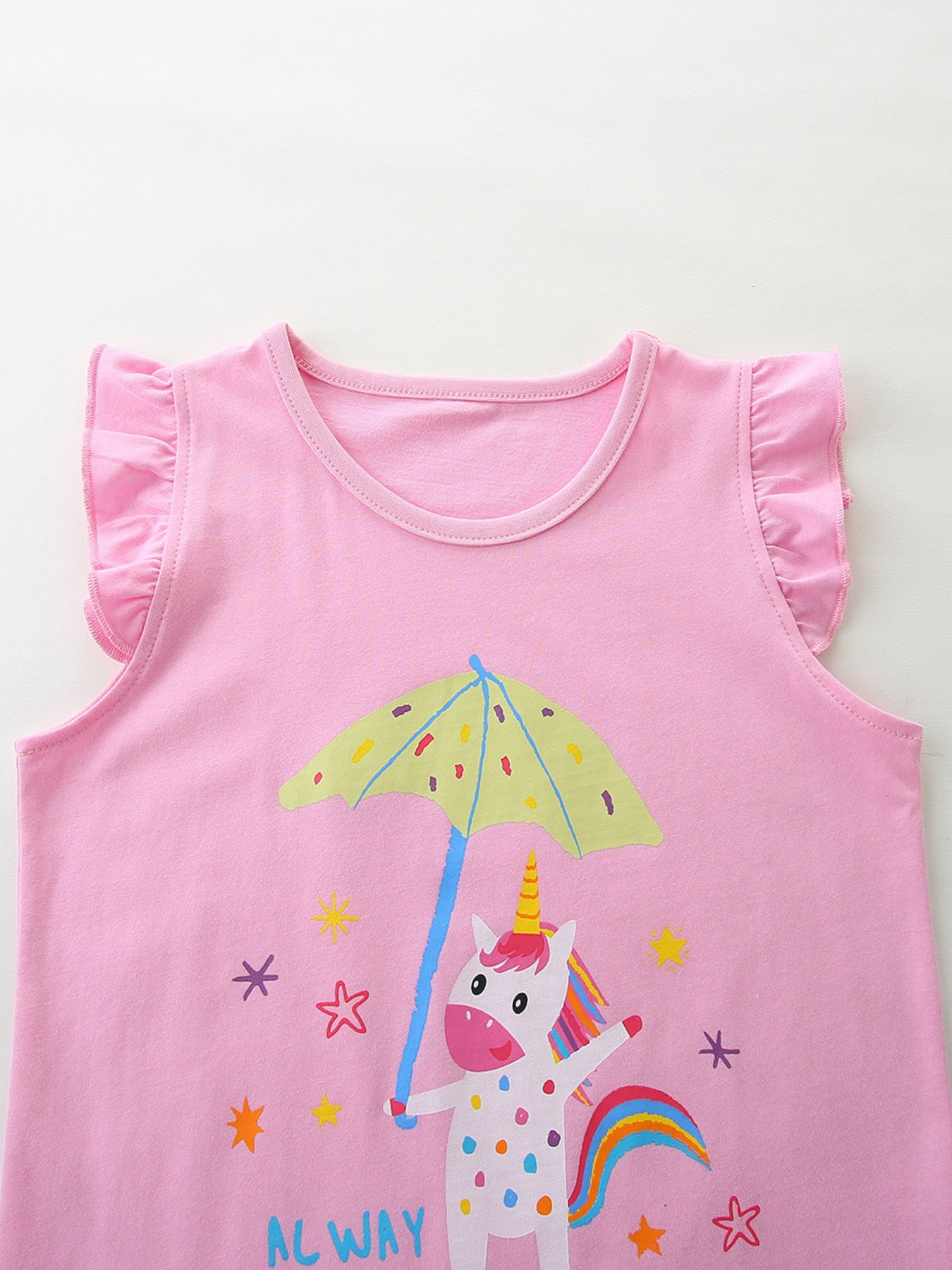 Pink cotton t-shirt with cap sleeves and a unicorn graphic holding an umbrella.
