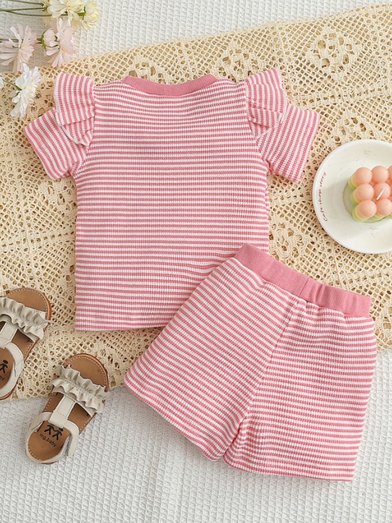 Baby pink and white striped cotton blend set with ruffle sleeves and shorts.