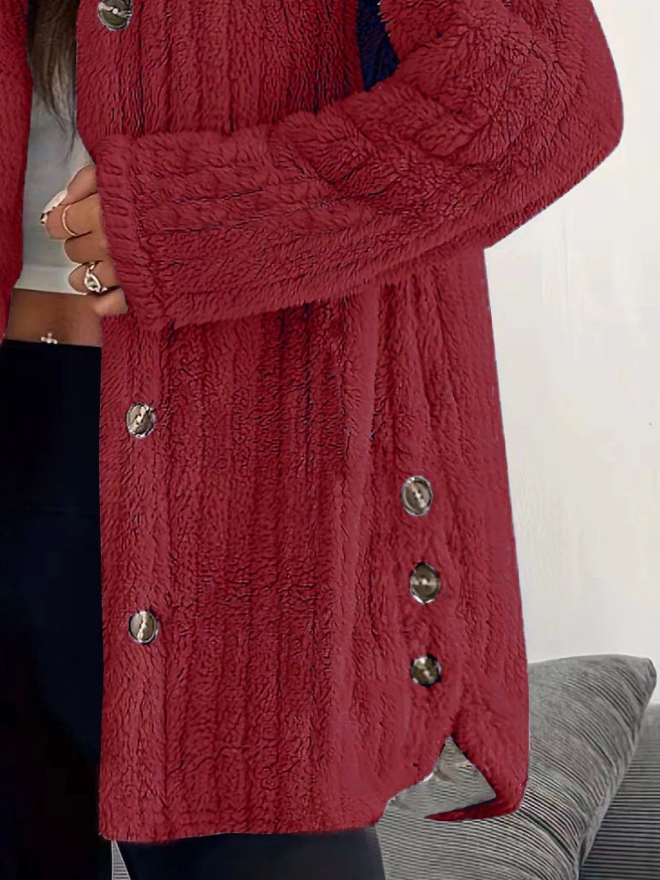 Red button-up fleece jacket with textured fabric and silver buttons