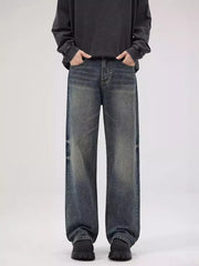 Men's relaxed fit blue wash denim jeans with a vintage look.