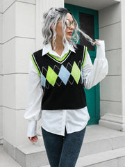 Argyle knit sweater vest with neon green and blue diamonds and trim, layered over a white shirt.