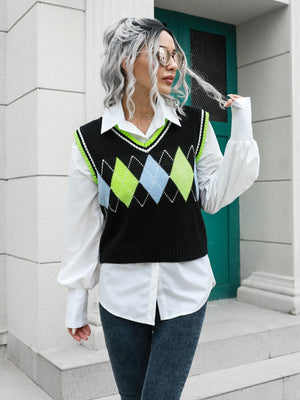 Argyle knit sweater vest with neon green and blue diamonds and trim, layered over a white shirt.