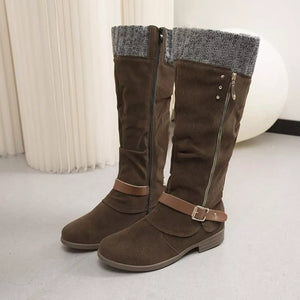 Brown suede knee-high slouch boots with grey knit detail and buckle strap.