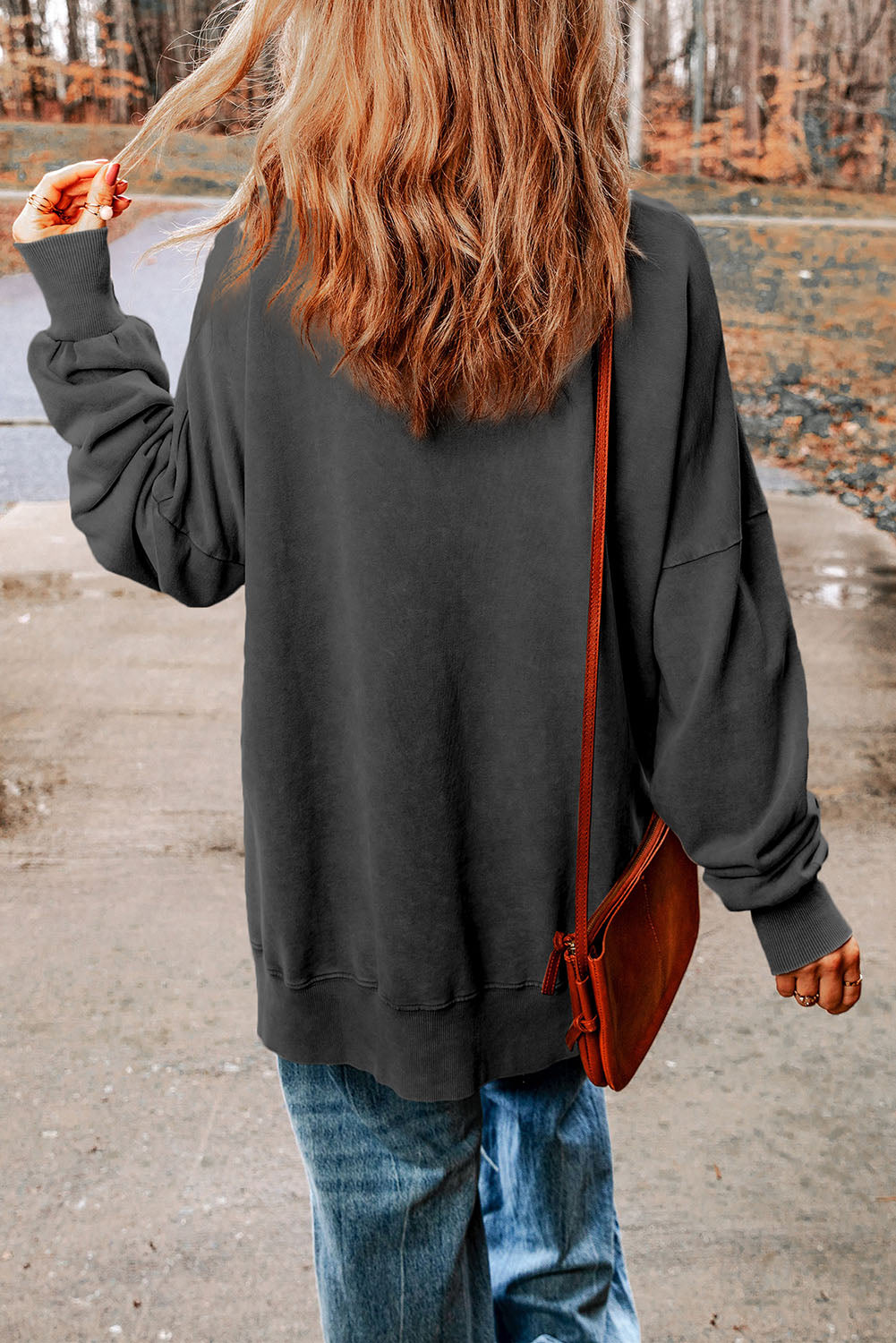 Oversized charcoal washed cotton sweatshirt with crew neck and cuffed sleeves.