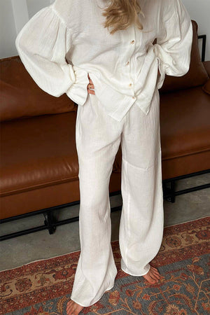 White gauze lounge set with voluminous sleeves and wide-leg pants.