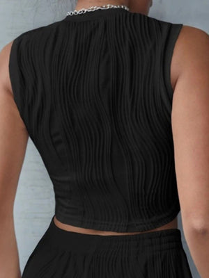 Black textured wave crop top with a mock neck and sleeveless design.