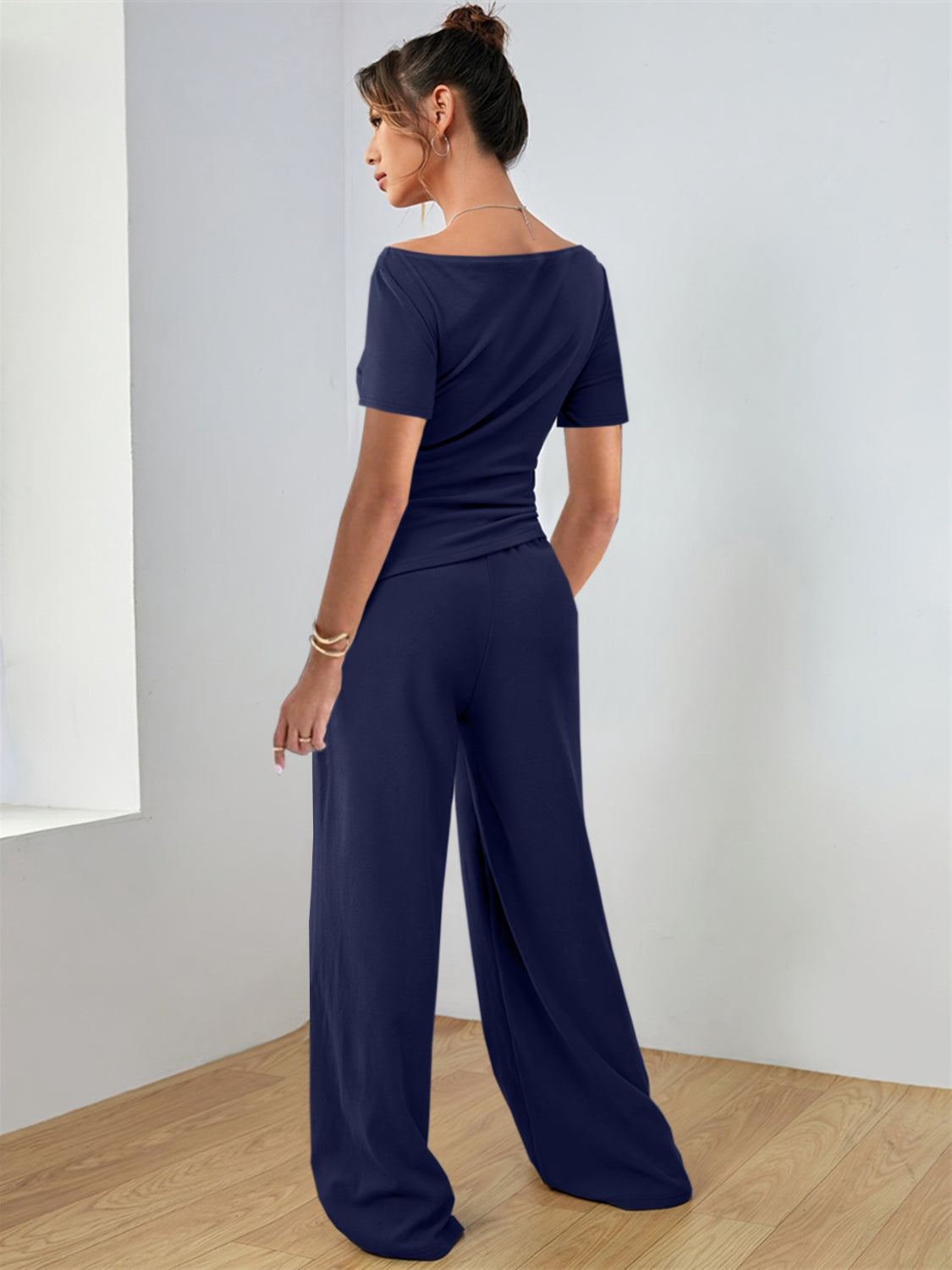 Boat neck jersey co-ord set in dark navy with wide leg pants.
