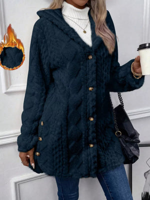 Navy hooded trench coat with cable knit texture and gold button detail.