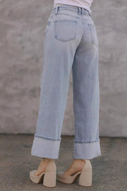 Light wash wide-leg denim jeans with contrast cuffs, shown cuffed.