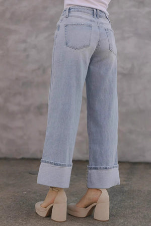 Light wash wide-leg denim jeans with contrast cuffs, shown cuffed.