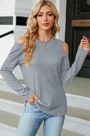 Textured cable knit cold shoulder top in gray with long sleeves.