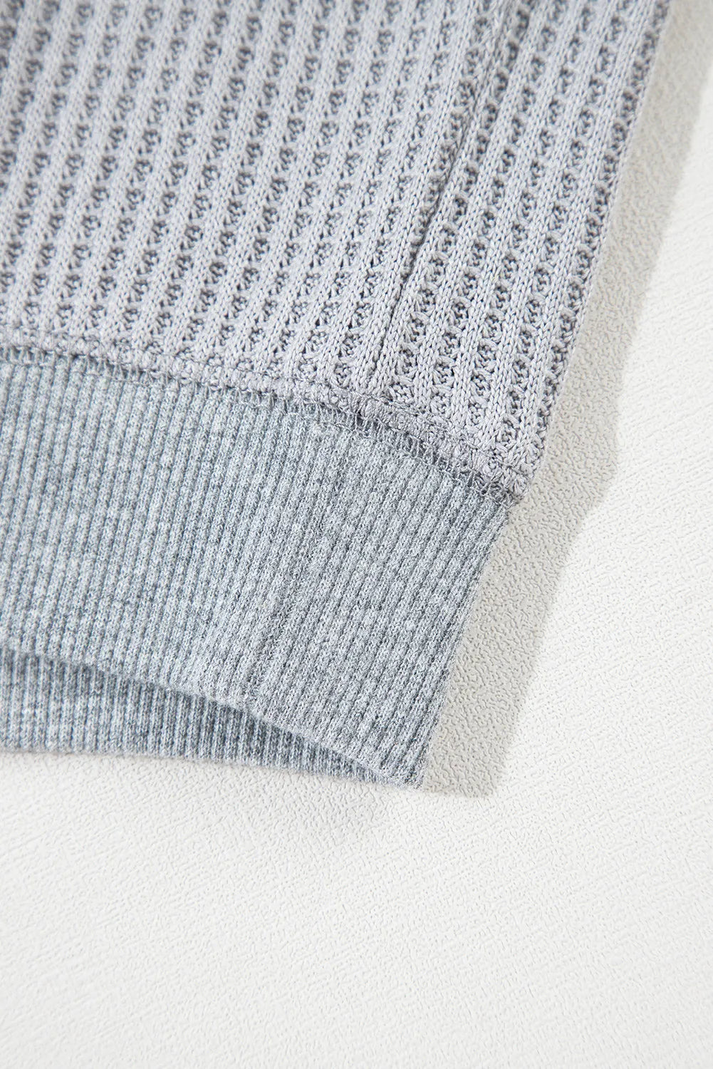 Gray waffle knit top with ribbed hem detail