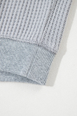Gray waffle knit top with ribbed hem detail
