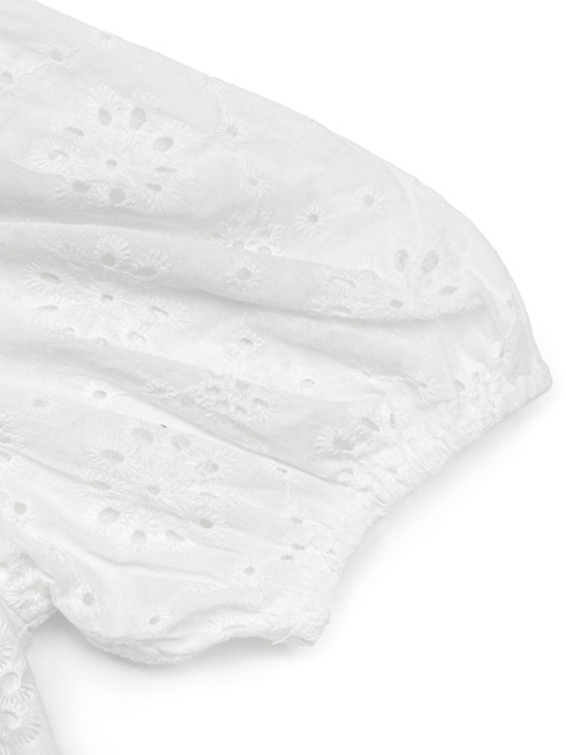 White eyelet puff sleeve bodysuit with floral embroidery detail.