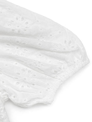 White eyelet puff sleeve bodysuit with floral embroidery detail.