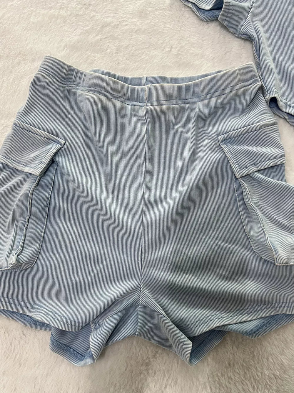 Sky blue ribbed two-piece set with cargo pockets and comfortable fit.