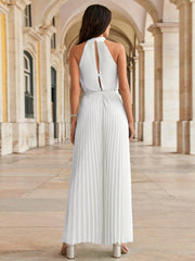 White halter neckline pleated palazzo jumpsuit with back cutout detail.