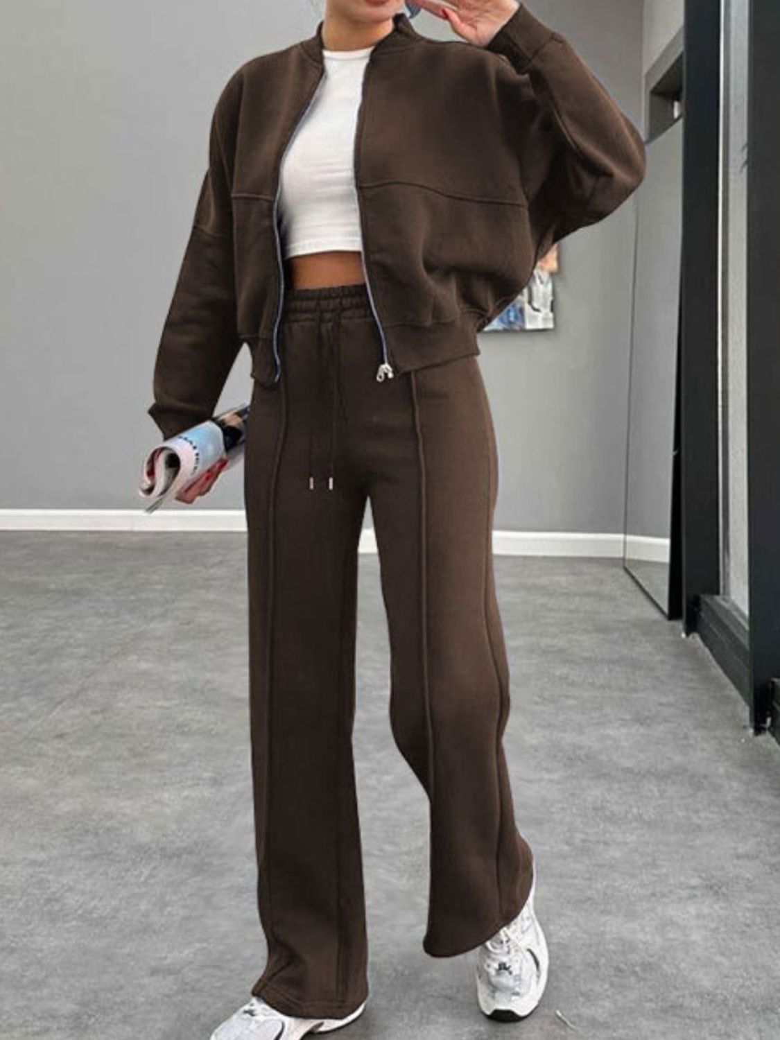 Coffee brown bomber jacket and wide-leg tracksuit with drawstring waist and zip closure.