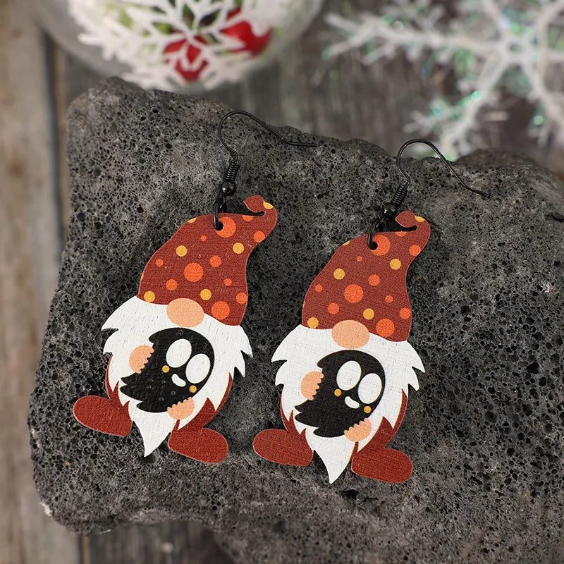 Spotted gnome wood dangle earrings in deep red with orange and yellow polka dots.